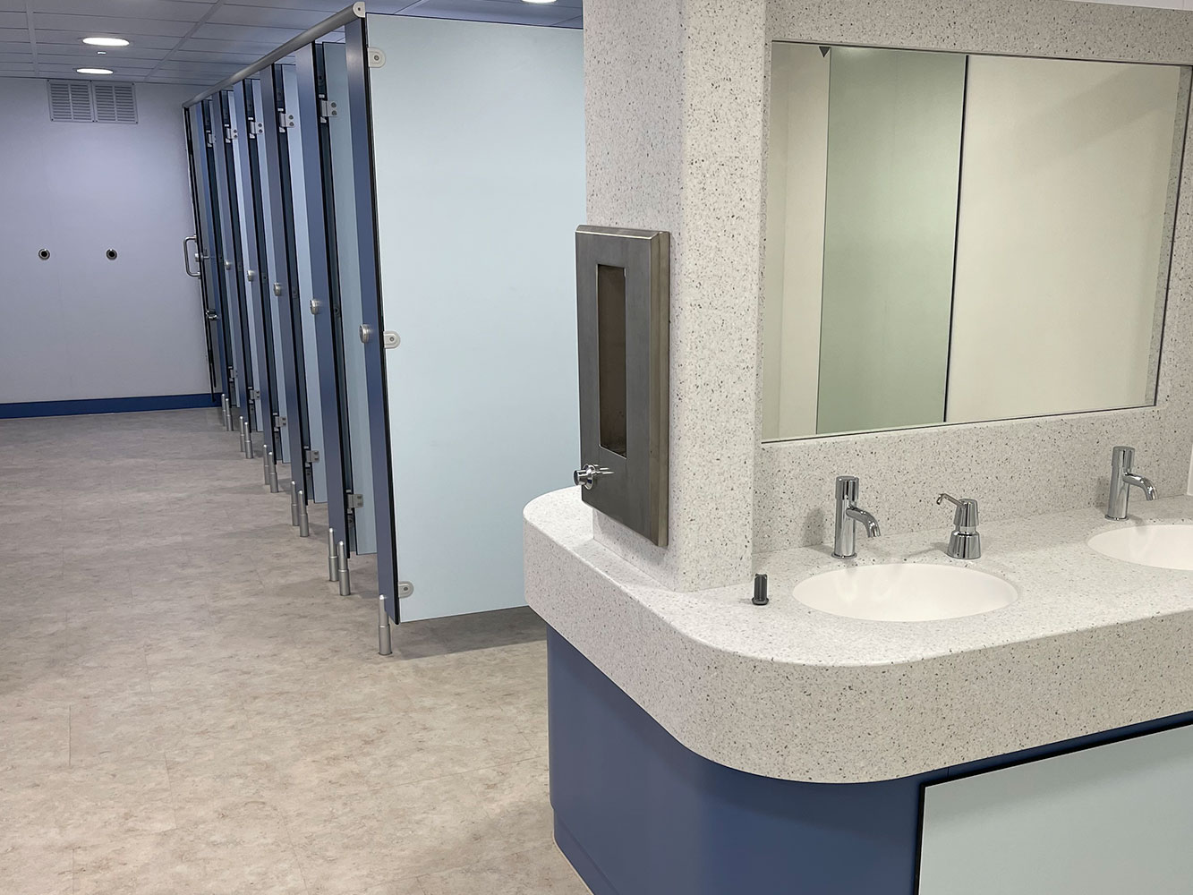 Modern toilet cubicles installed as part of a school toilet refurbishment.